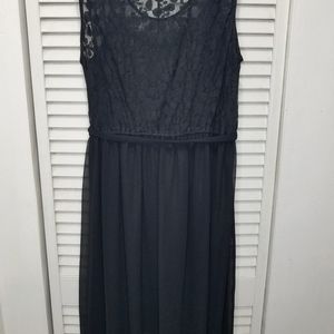 Black  sheer lace back dress high front  and a long back.